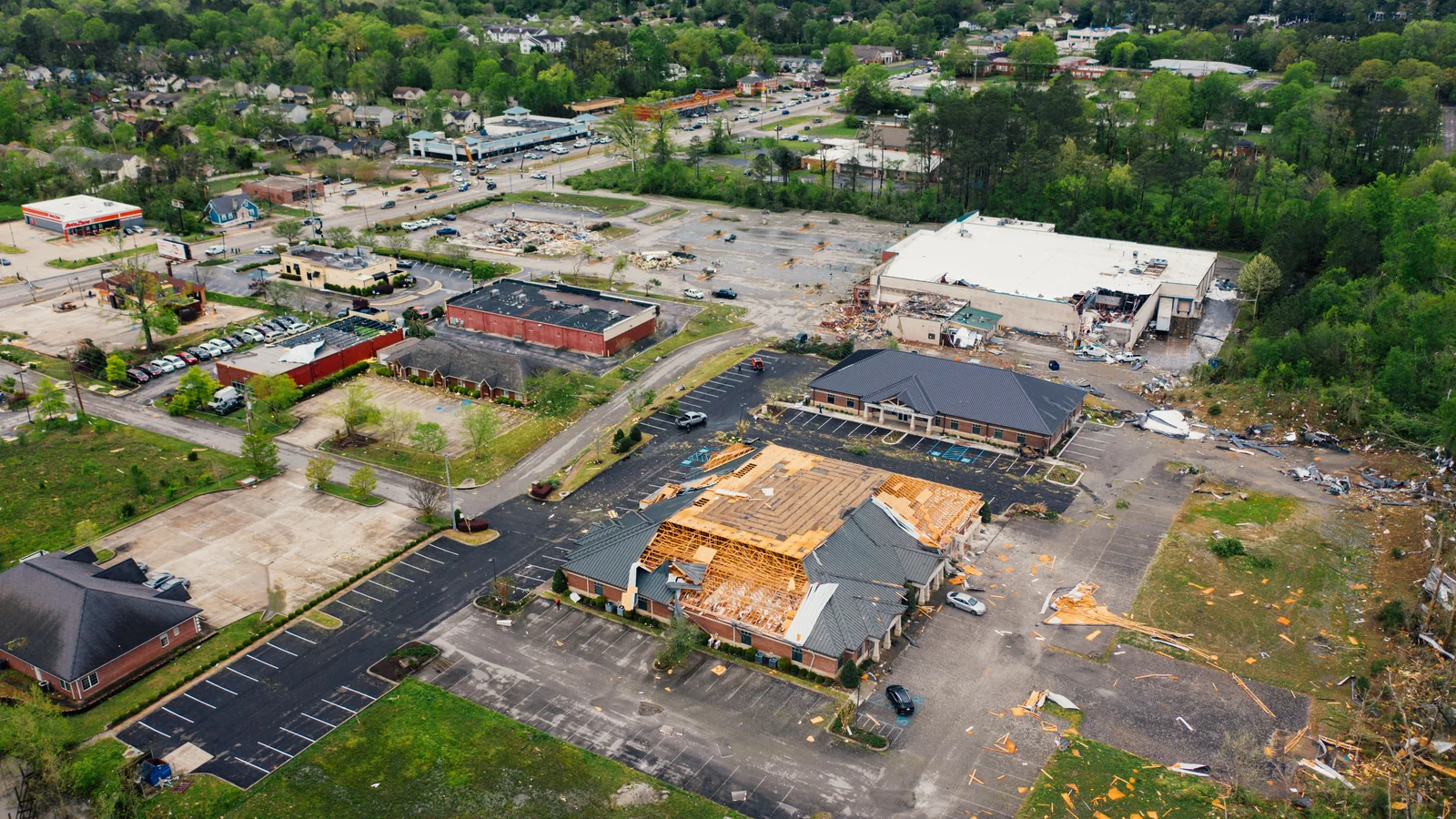 Roof storm damage in North Carolina guide showing an example of severe wind damage to residential roofs